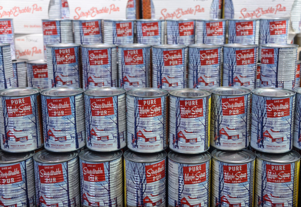 cans of maple syrup