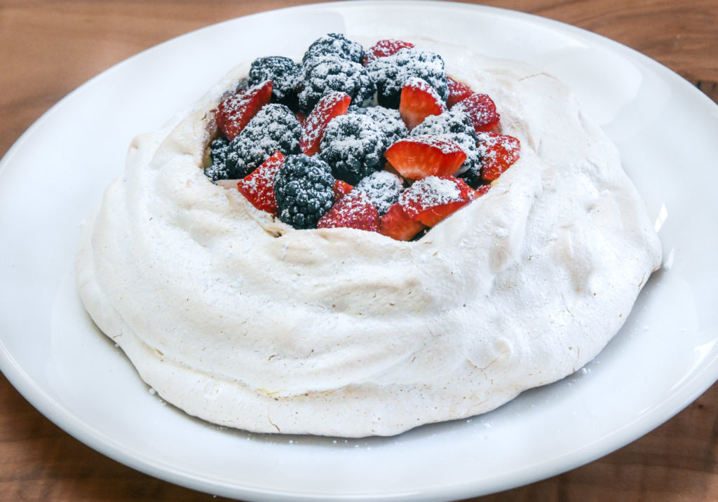 pavlova with custard and berries