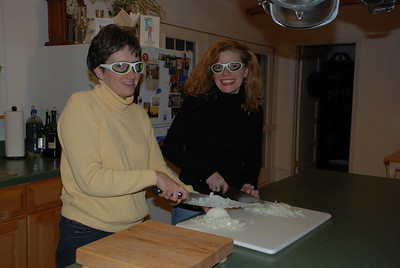 Goggle girls chopping onions