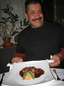Juan with perfect plating and potted plant at Paloma