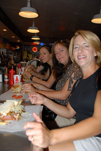 Seated at the counter of Primanti Bros. - Marilee, Jen, Nickie and Ann's arm