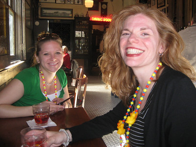 Emily and Kathy laughing over their Sazeracs