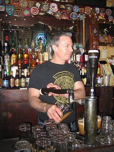Mike pouring Guinness at the Kerry