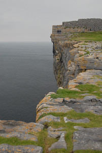 Cliff, Dun Aenghus and two brave -- or insane -- guys sitting near the edge
