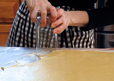 CUTTING OUT THE CRESCENT-SHAPED COOKIES