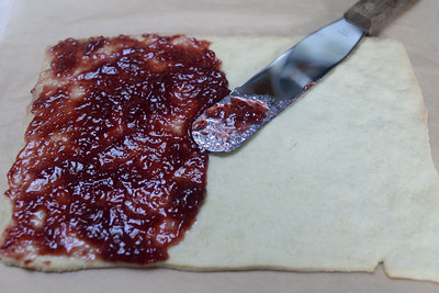spreading raspberry jam