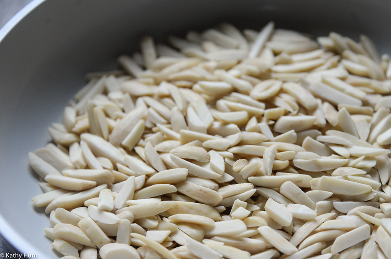 toasting almonds in a pan