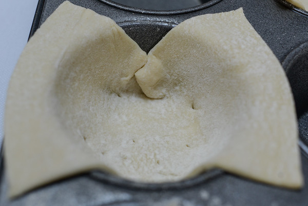 puff pastry cut to fit a muffin cup