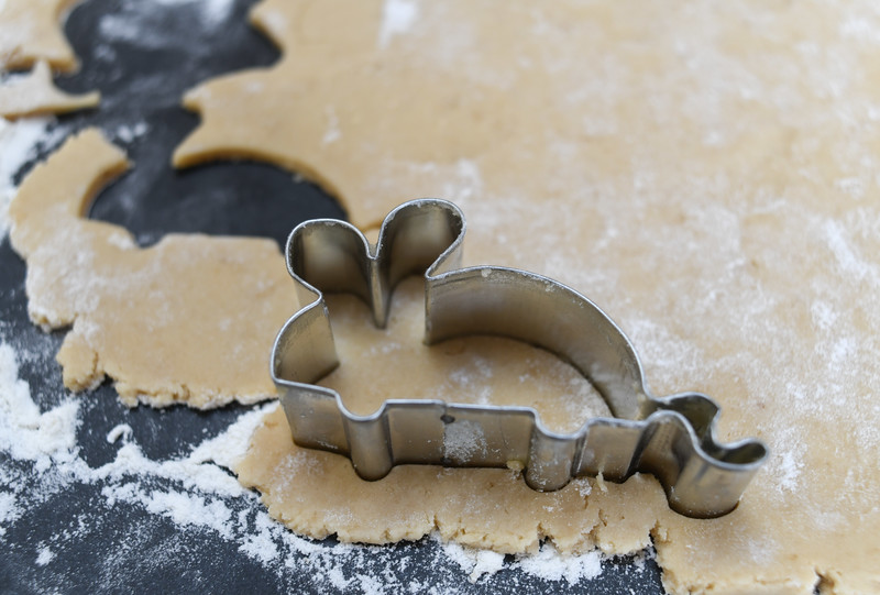 cutting mouse-shaped maple sugar cookies