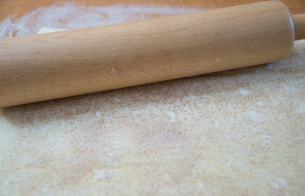 rolling out cinnamon palmier dough